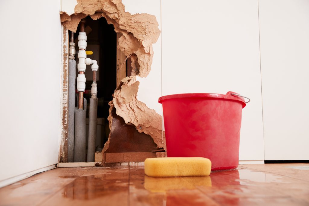 water damage revealing hidden pipes