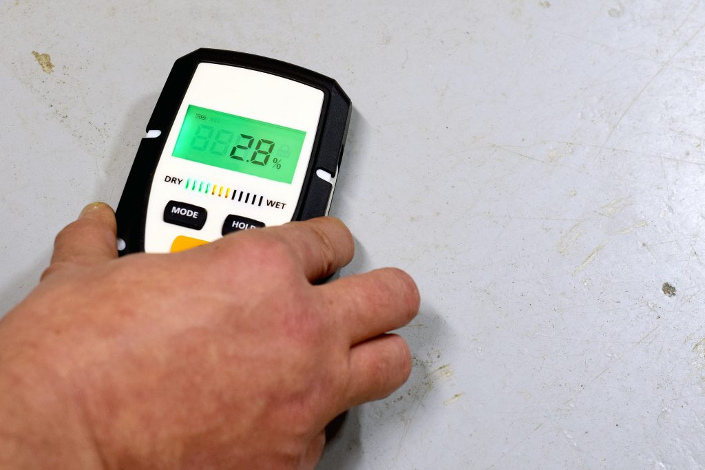 waterproofing specialist using moisture device